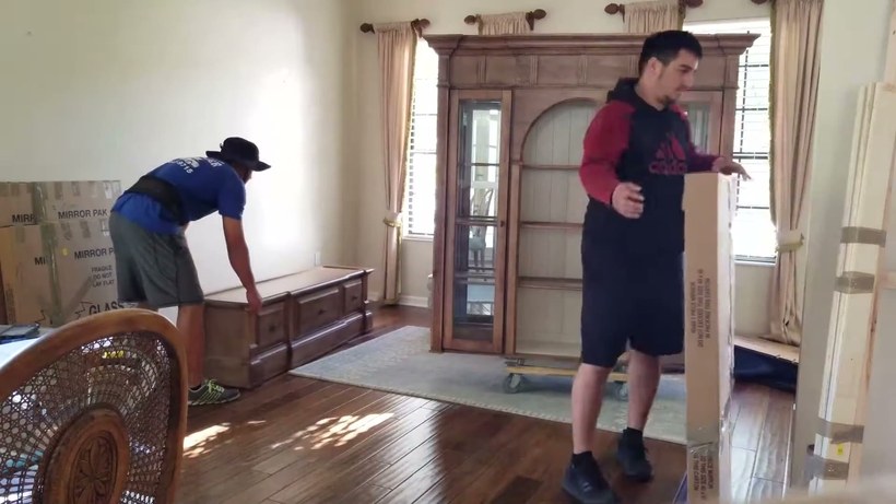 All Aboard Movers crew handling a piece on a San Antonio job