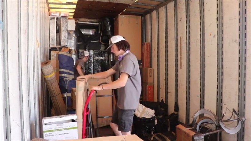 All Aboard Movers crew handling a piece on a San Antonio job